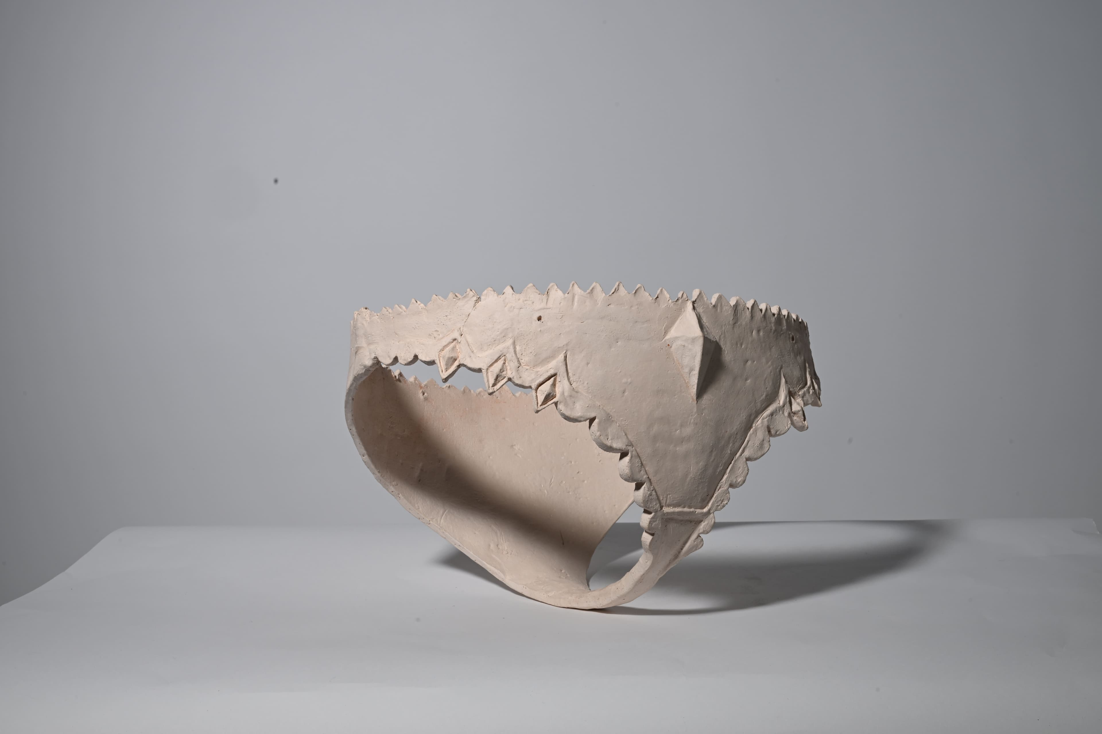 image of clay sculpture in the shape of underwear,bisque fired front view