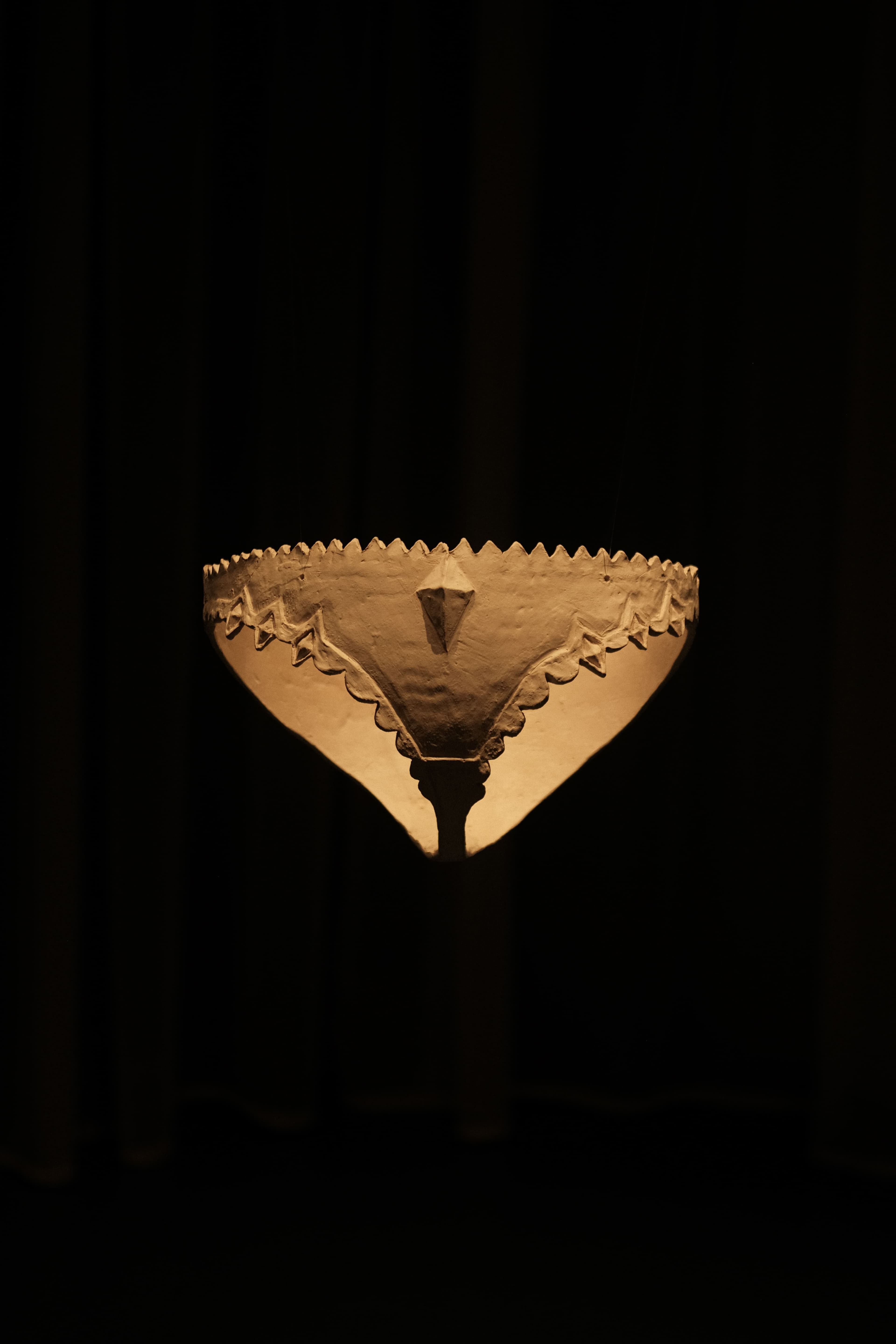 underwear made from clay, hanging in the air, with black background
